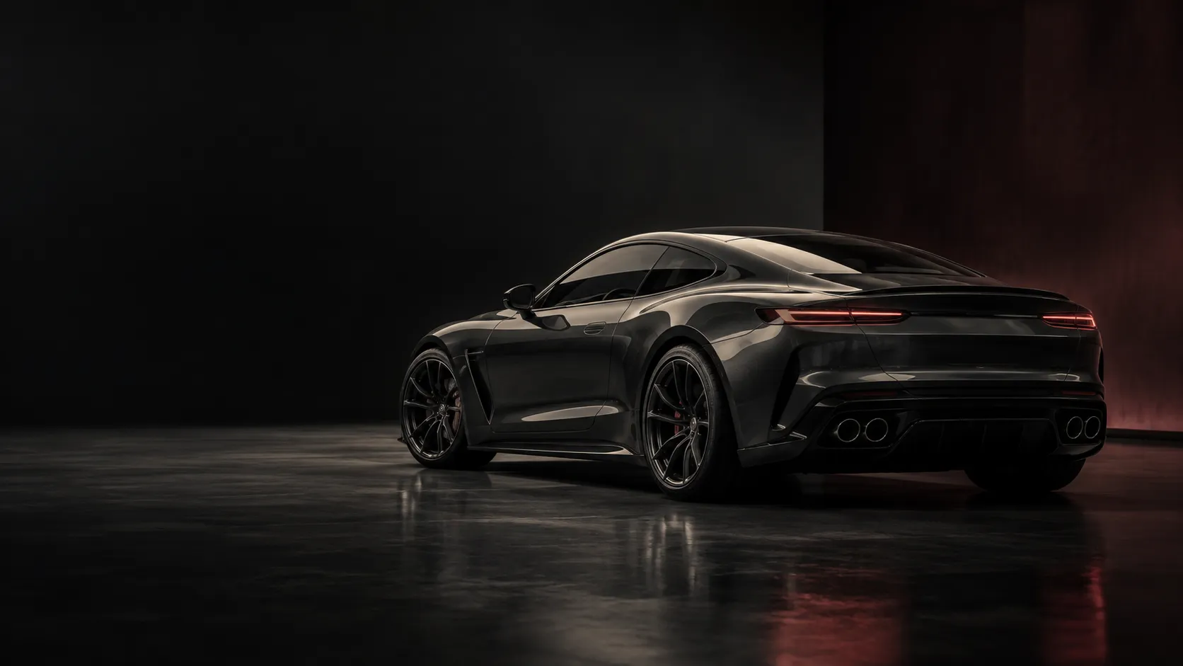 A dark performance car in a softly lit detailing studio